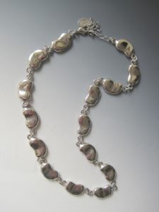 cast-silver-meta- bean-necklace